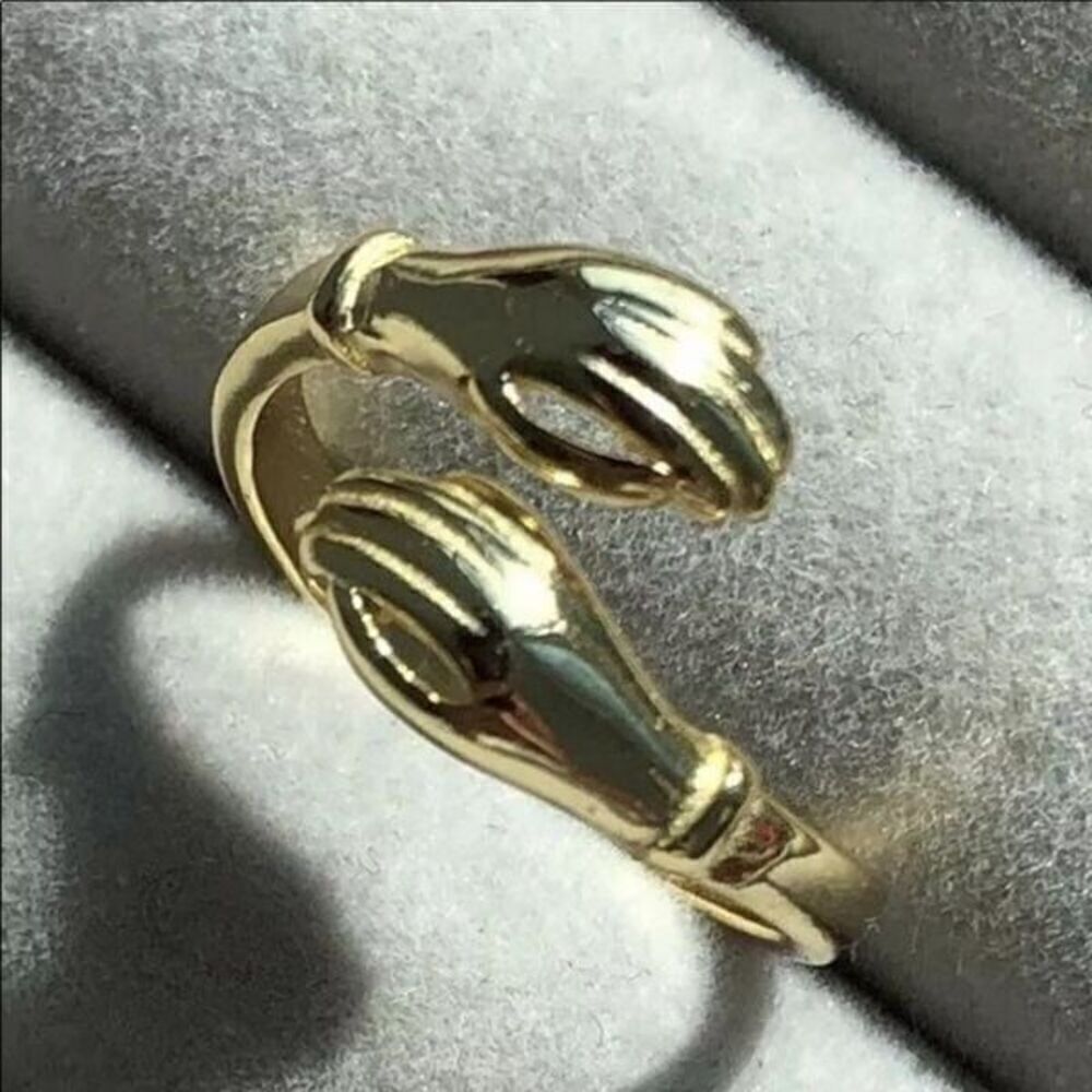 The Hold Me Close hand holding” or hug”  adjustable ring in 18k